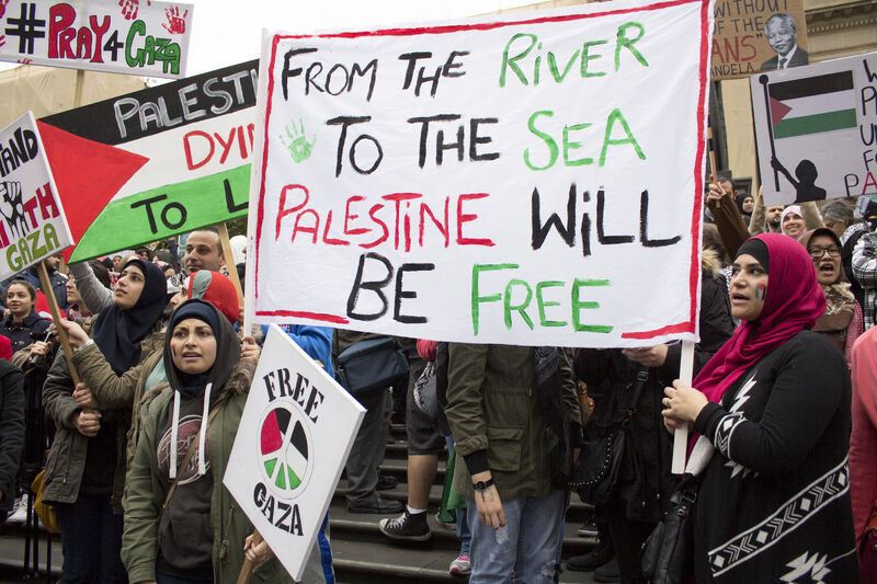 Palestine protest from the river to the sea banner.